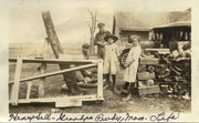 1925 Milo and family cutting wood